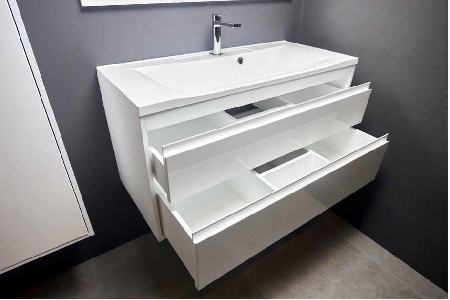 A white sink with drawers